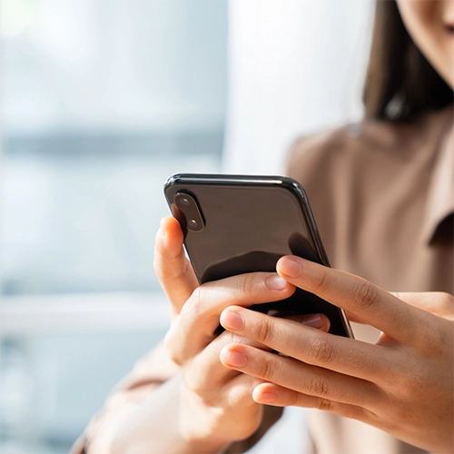 Person holding their phone