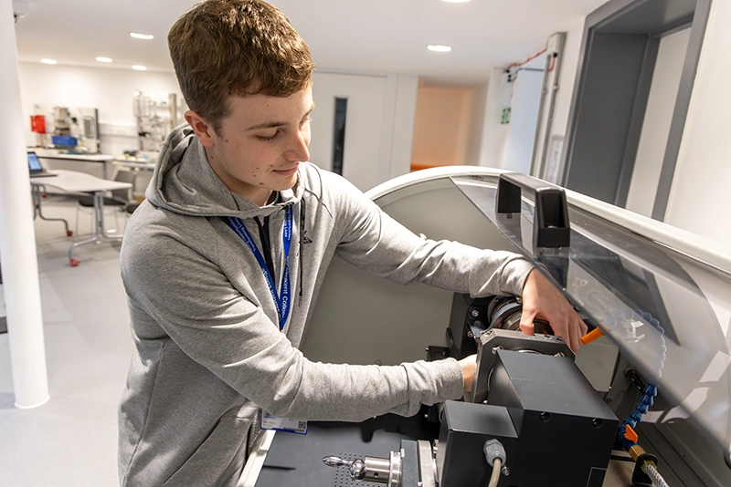 Civil Engineering student working on machine