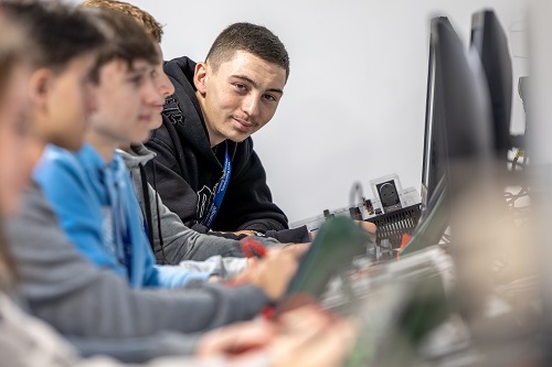 Students sat at computers in classroom