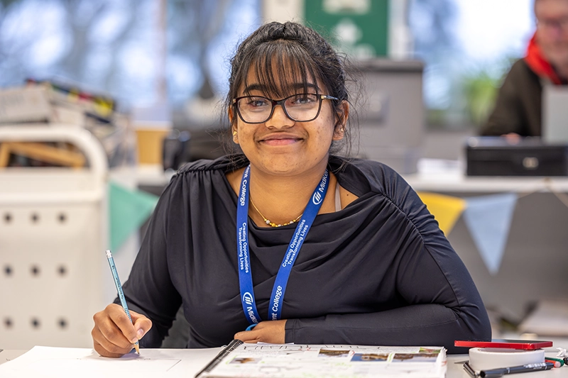 Student working on their porfolio in the art workshop