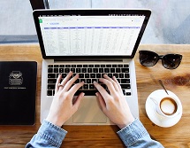 Someone typing on a laptop